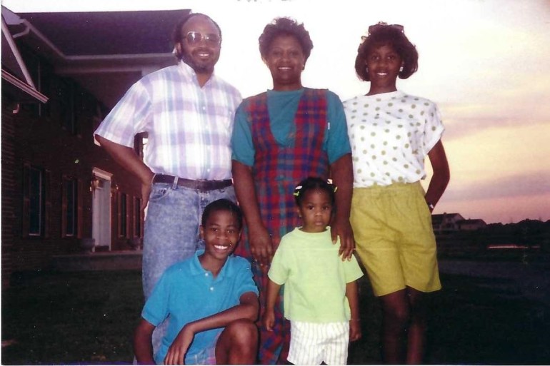 A color film photograph of Cara Anthony’s family standing together in the early ’90s.