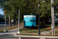 A photo of a directory sign with Atrium Health's logo displayed on it.