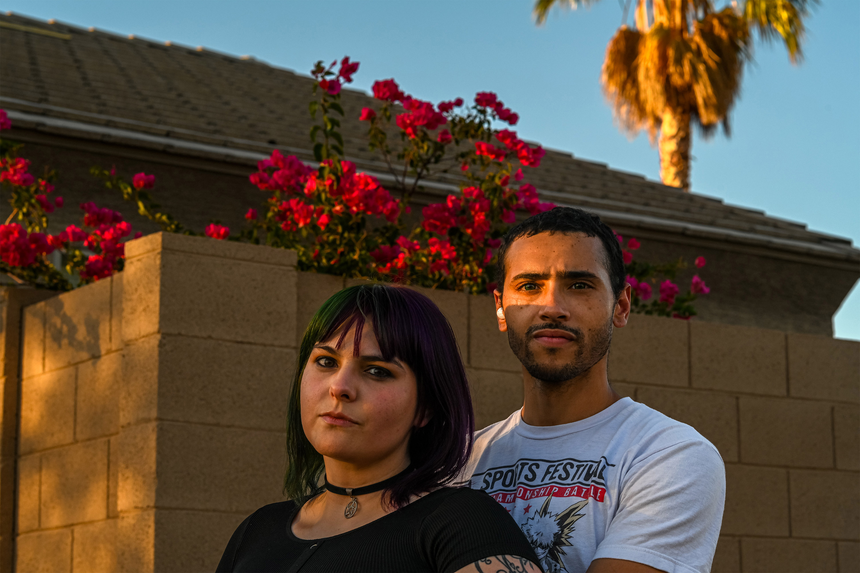 A photo of a woman and man standing outside.