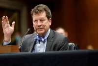 A photo of Robert Califf speaking at a Senate hearing.