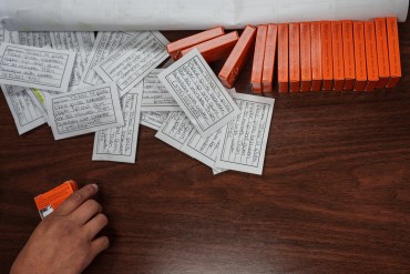 A photo shows boxes of mifepristone pills next to cards with instructions listed on them.