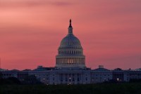 A photo of the dome of the U.S. Capitol at dawn.