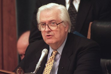 Rep. Henry Hyde is seen speaking into a microphone before the House Judiciary Committee.