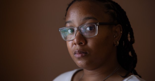 A photo of a Black woman looking into the camera.