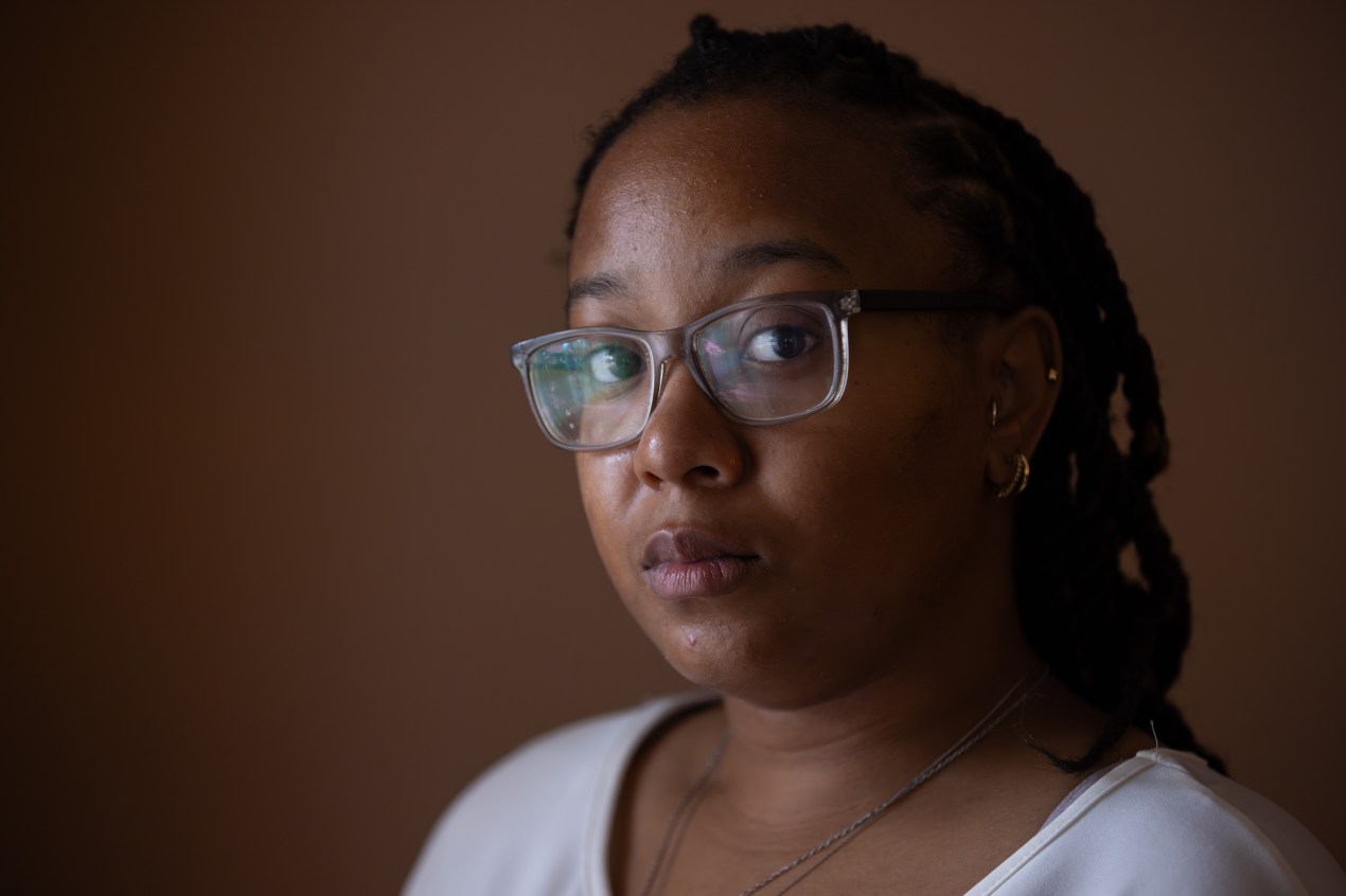 A photo of a Black woman looking into the camera.