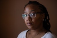 A photo of a Black woman looking into the camera.